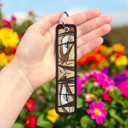 Sharp-Eyed Hero Embroidered Keychain